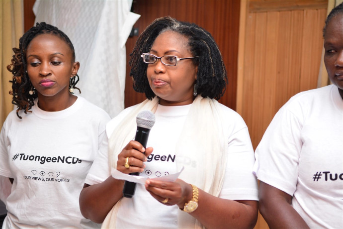 A lady speaking at a plenary session