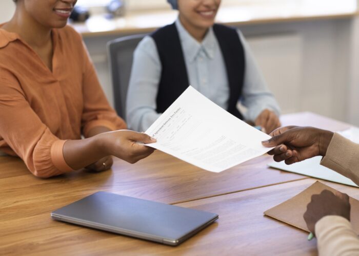 man-holding-contract-his-new-office-job-after-interview